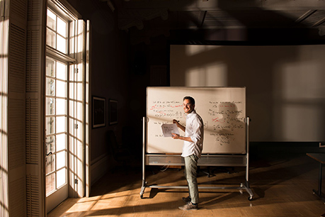 Man standing at a whiteboard. Link to Gifts from Retirement Plans retirement.jpg
